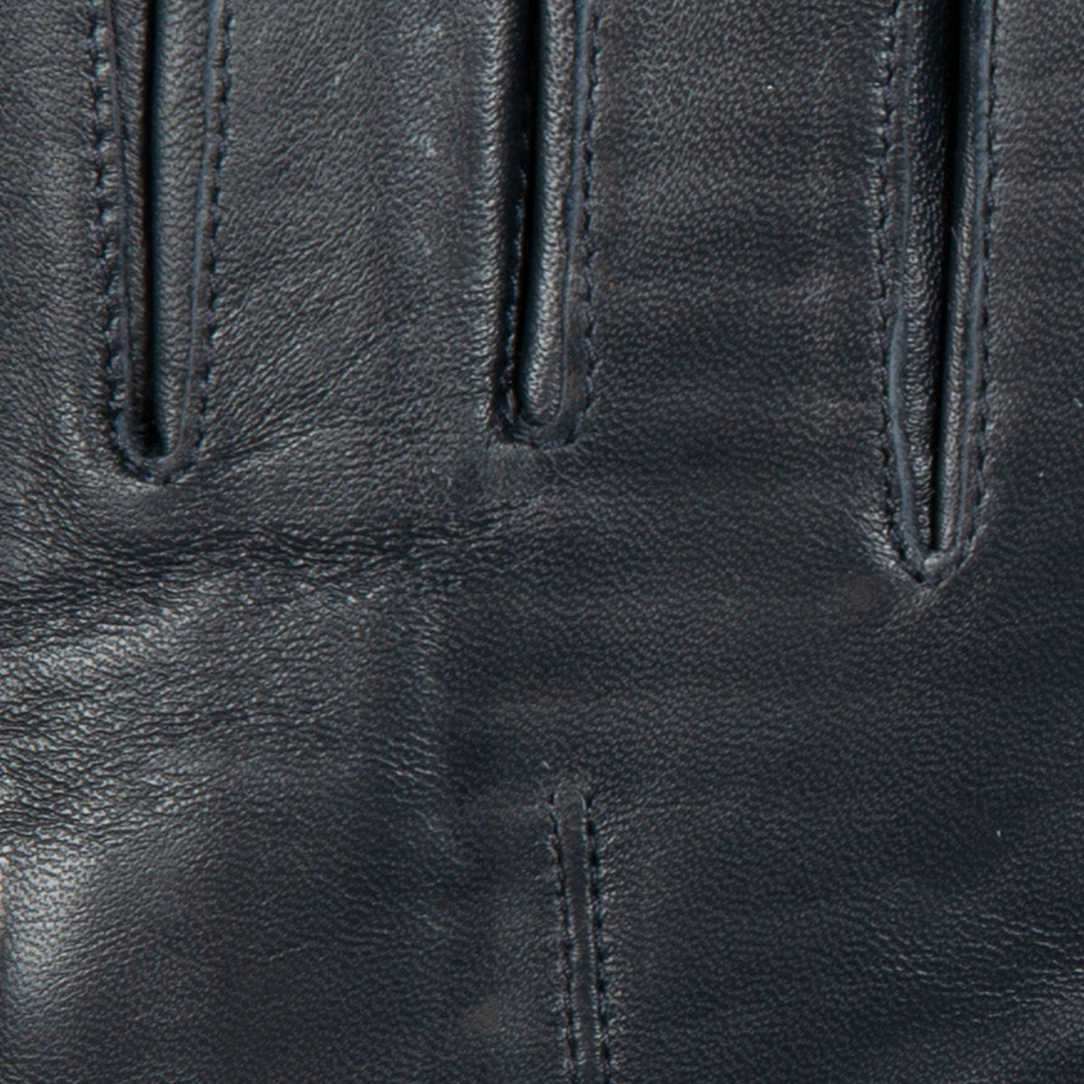 Women's touchscreen single-point faux fur lined leather gloves in navy fingers